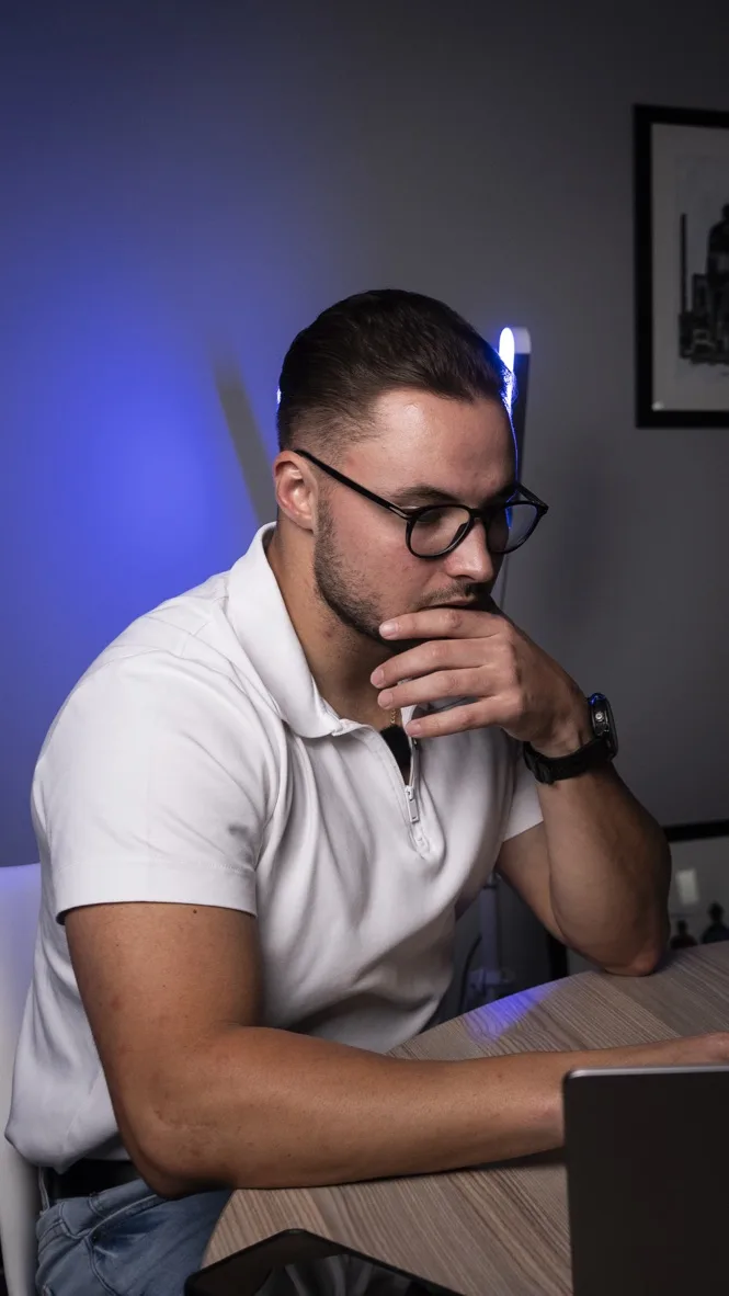 Joshua at his desk, thinking through a problem